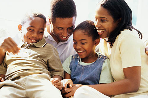 An African American family spending quality time together, laughing and enjoying each other's company