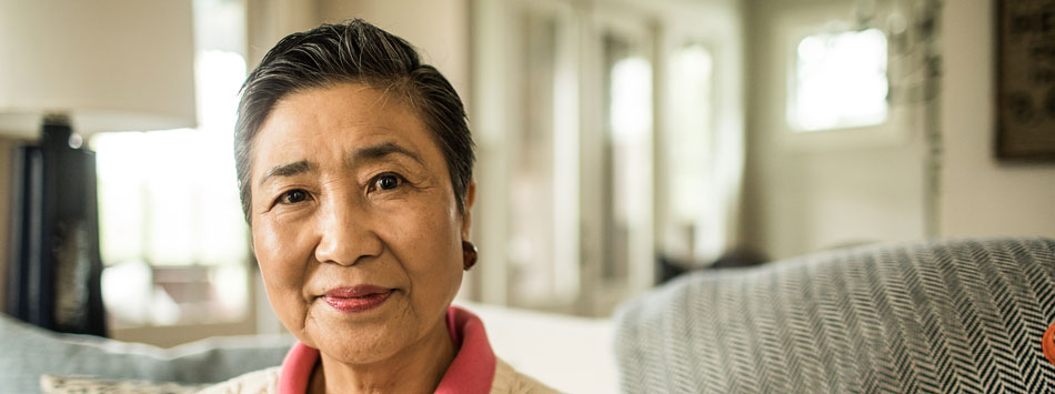 Portrait of older Asian female patient concerned with her Ovarian Cancer diagnosis